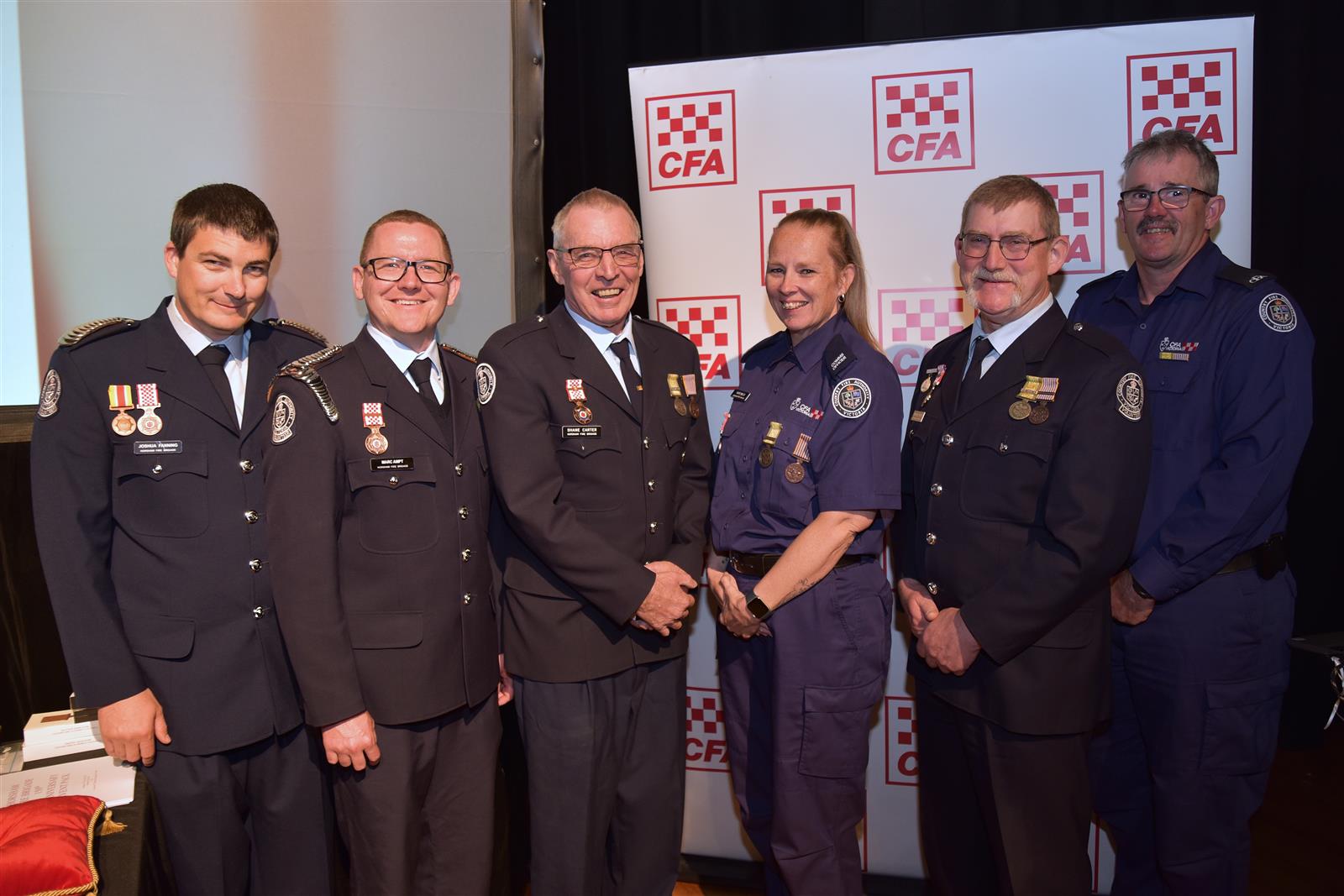 From left, National Medal recipients Josh Fanning, Marc Ampt, Shane Carter and Kate Wills, with brigade life members Michael Ziersch and Graham Hill.
